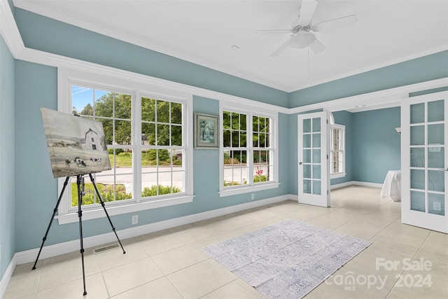 interior space with ceiling fan and french doors