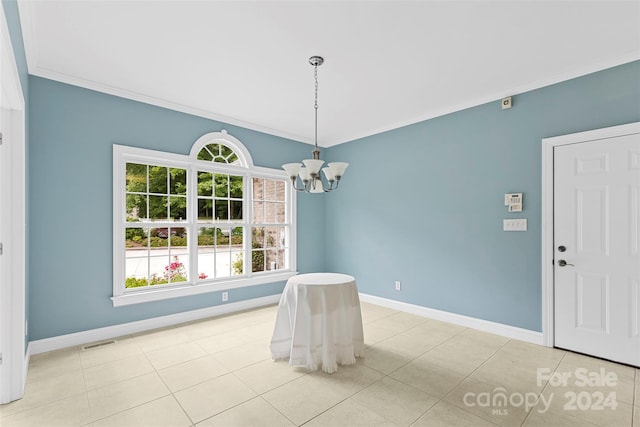 unfurnished dining area featuring light tile patterned floors, ornamental molding, and an inviting chandelier