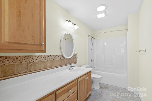 full bathroom featuring shower / bathing tub combination, vanity, toilet, and tile patterned flooring