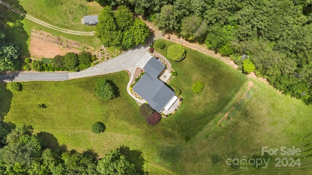 birds eye view of property with a rural view