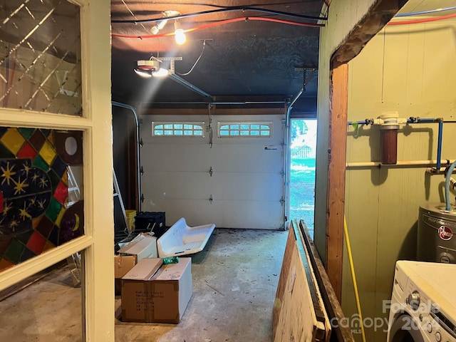 garage with a garage door opener and washer / clothes dryer