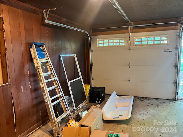 garage featuring wooden walls