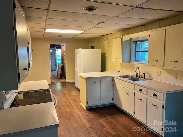 kitchen with white cabinetry, white appliances, sink, and dark wood-type flooring