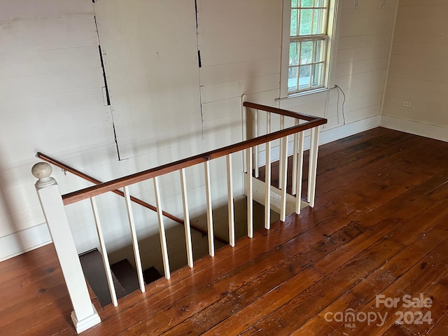 staircase featuring wood-type flooring