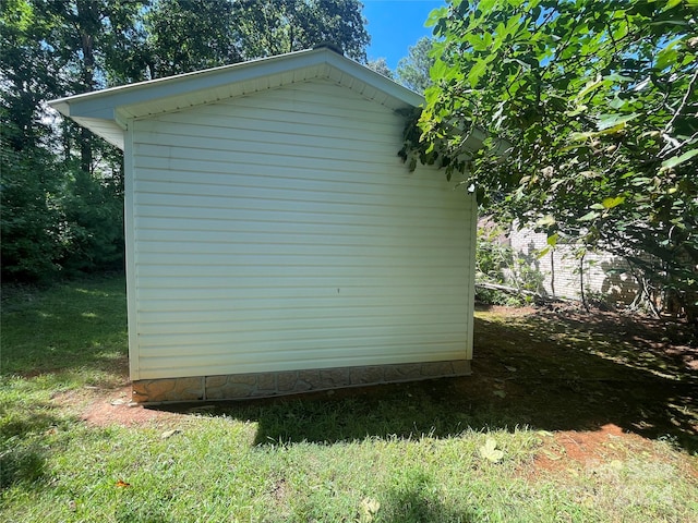 view of property exterior featuring a lawn