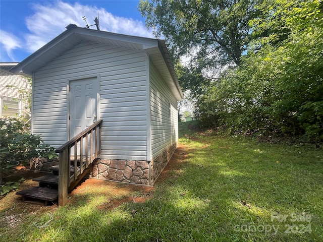 view of property exterior with a lawn