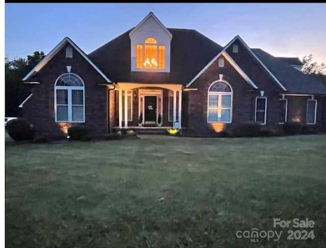 view of front of home with a yard