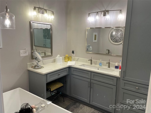 bathroom featuring a tub and vanity