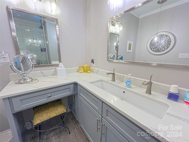 full bath with a shower stall, crown molding, and vanity