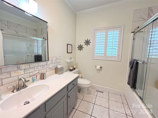 bathroom with tile patterned flooring, toilet, vanity, backsplash, and crown molding