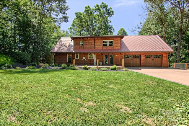 log home featuring a front yard and a garage