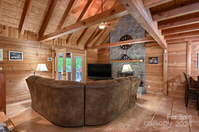 living room featuring ceiling fan, wooden ceiling, vaulted ceiling with beams, light hardwood / wood-style floors, and wooden walls