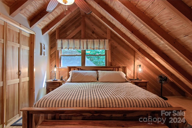 unfurnished bedroom featuring vaulted ceiling with beams, ceiling fan, wooden walls, and wood ceiling