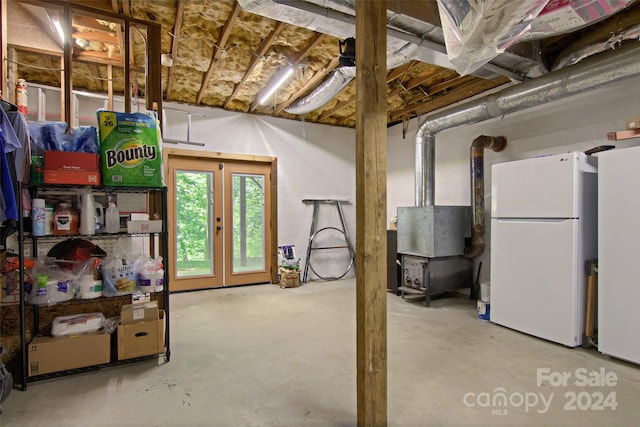 basement featuring white refrigerator