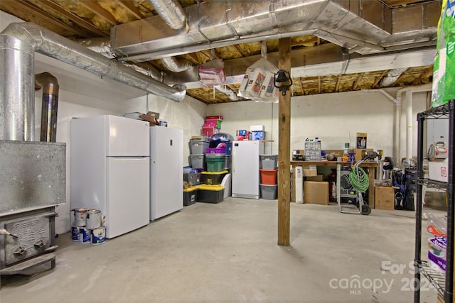 basement with white refrigerator