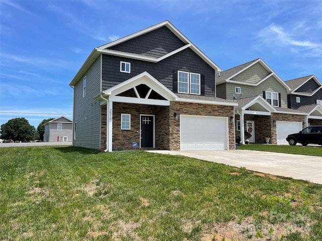 view of front of property with a garage and a front lawn