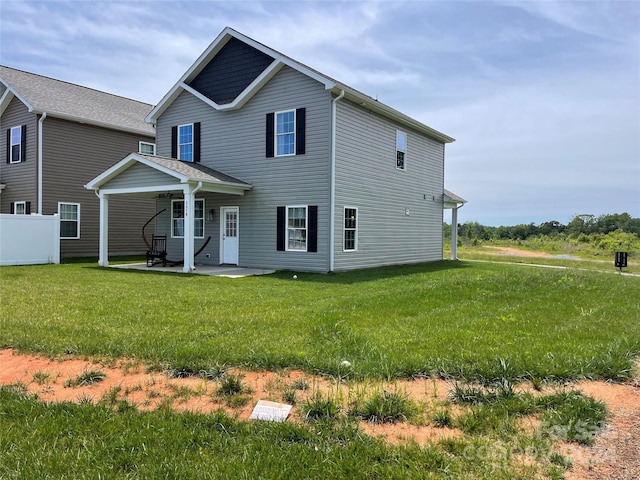 view of front of property with a patio area and a front yard