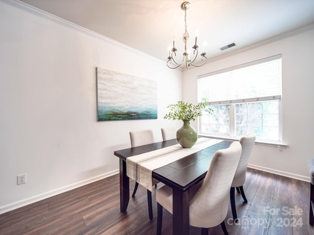 dining area with a chandelier, dark hardwood / wood-style flooring, a wealth of natural light, and crown molding