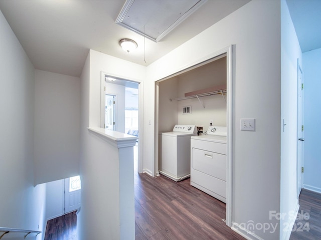 laundry area featuring dark hardwood / wood-style flooring and washing machine and dryer