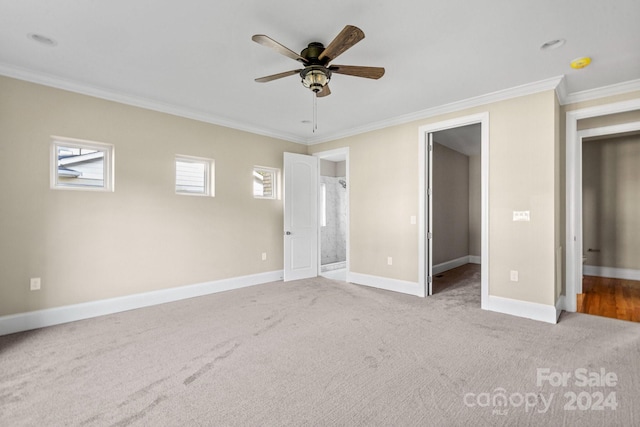 unfurnished bedroom with connected bathroom, a closet, crown molding, ceiling fan, and light carpet