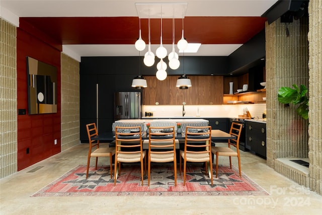 dining space featuring sink