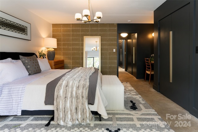 carpeted bedroom with an inviting chandelier