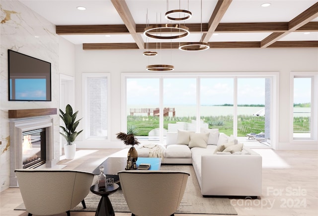 living room with beam ceiling, a chandelier, and a premium fireplace