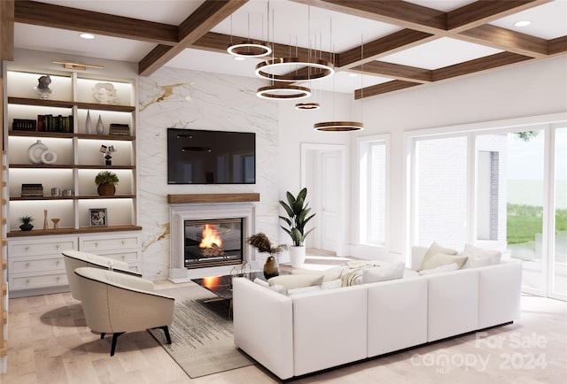 living room with coffered ceiling, a chandelier, beamed ceiling, and a fireplace