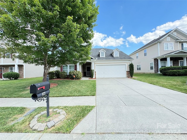 view of front of house featuring a garage and a front yard