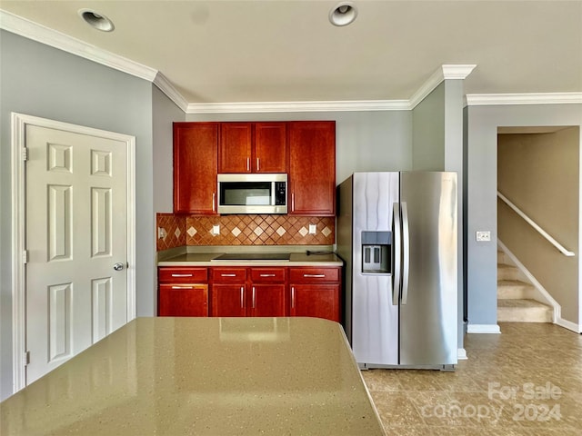 kitchen featuring backsplash, ornamental molding, and appliances with stainless steel finishes