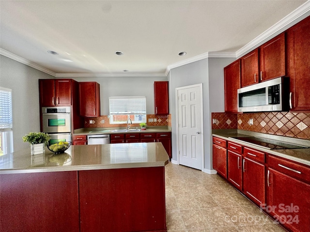 kitchen with decorative backsplash, sink, ornamental molding, and stainless steel appliances