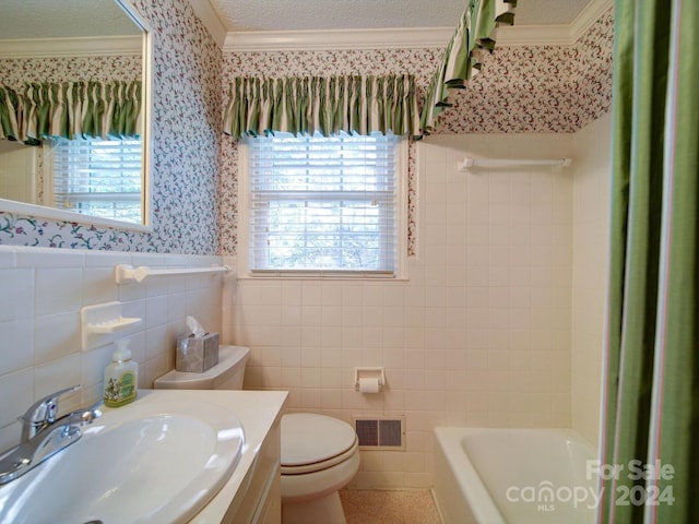 bathroom featuring vanity, toilet, and tile walls