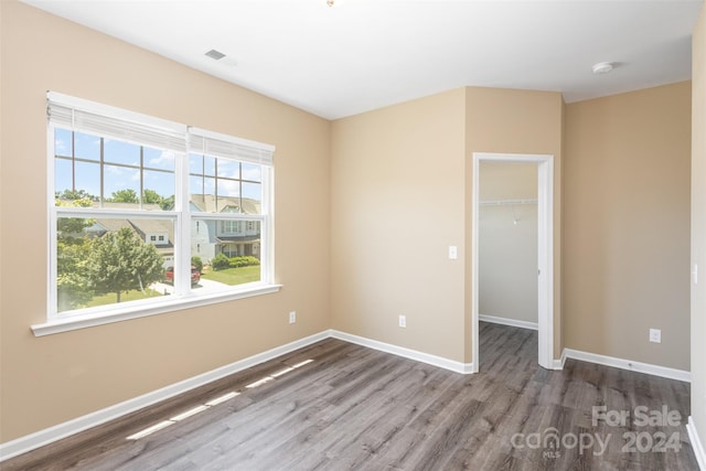 spare room featuring hardwood / wood-style floors