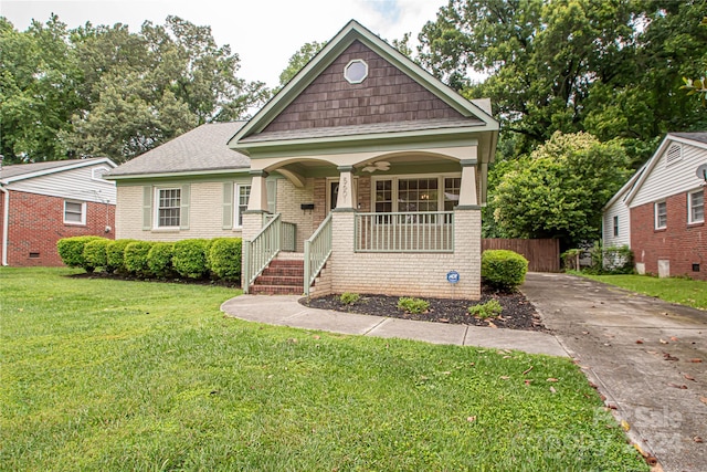 view of front facade with a porch and a front lawn