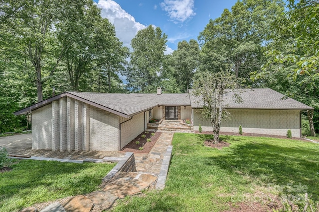 ranch-style house with a front lawn