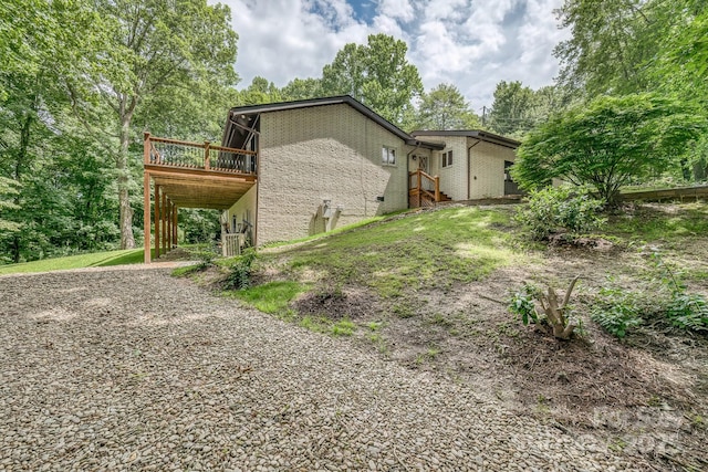 exterior space featuring a wooden deck and central AC