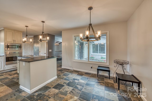 kitchen with a notable chandelier, decorative light fixtures, decorative backsplash, and appliances with stainless steel finishes