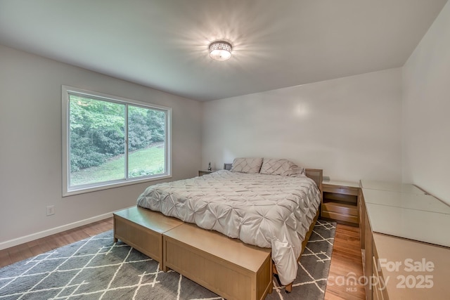 bedroom featuring dark hardwood / wood-style floors