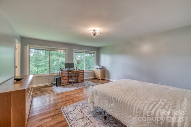 bedroom with light hardwood / wood-style flooring