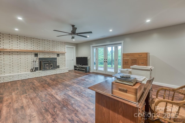 living room with ceiling fan, dark hardwood / wood-style flooring, and french doors