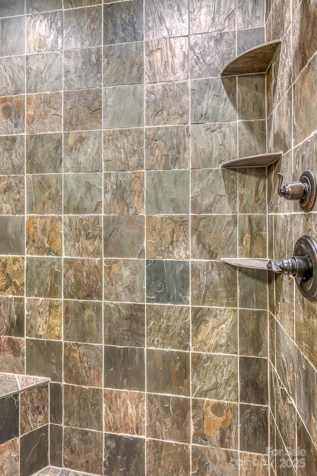 bathroom featuring tiled shower