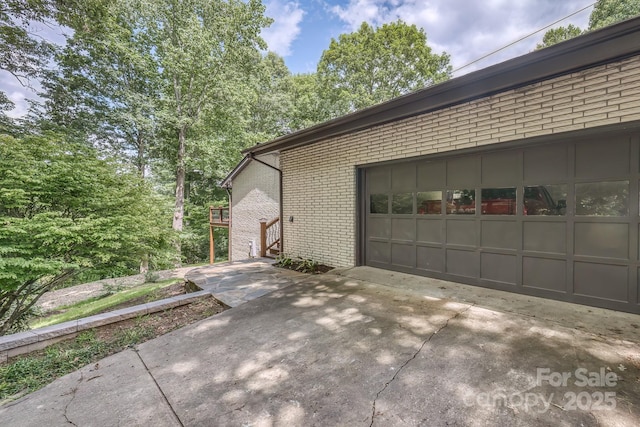 view of side of property with a garage