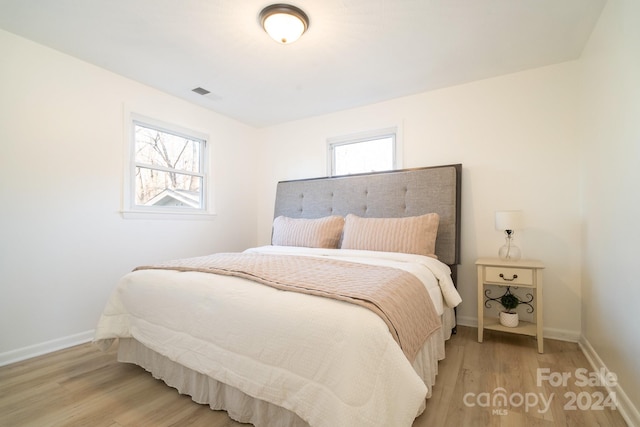 bedroom with light wood-type flooring