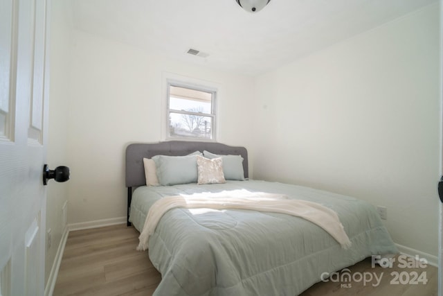 bedroom with light hardwood / wood-style floors