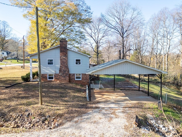 view of side of property with a carport