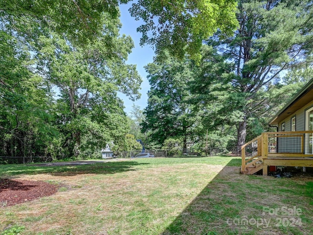 view of yard featuring a wooden deck