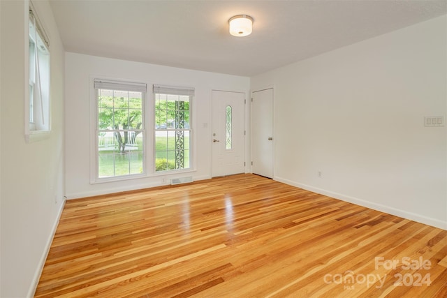 spare room with light hardwood / wood-style floors