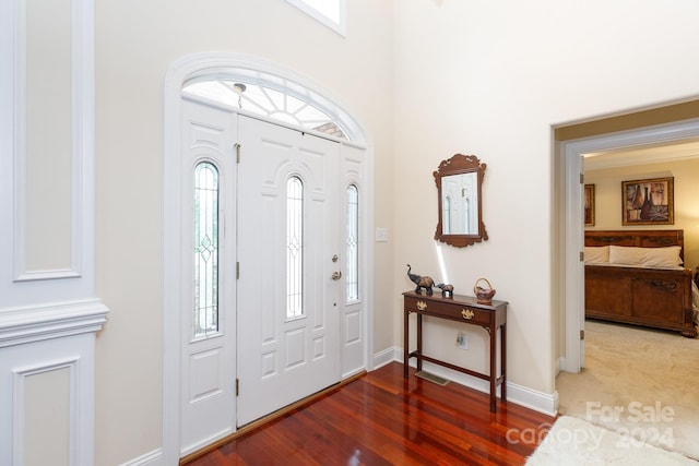 entryway with hardwood / wood-style flooring