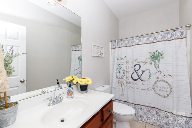 bathroom with tile patterned floors, vanity, a shower with shower curtain, and toilet