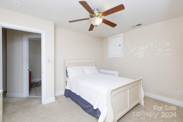 bedroom featuring ceiling fan and light colored carpet